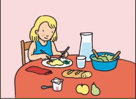 Un enfant atablé devant un repas