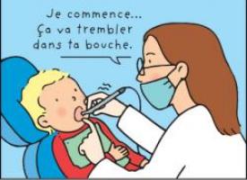 Un dentiste se prépare à soigner un enfant avec une fraise